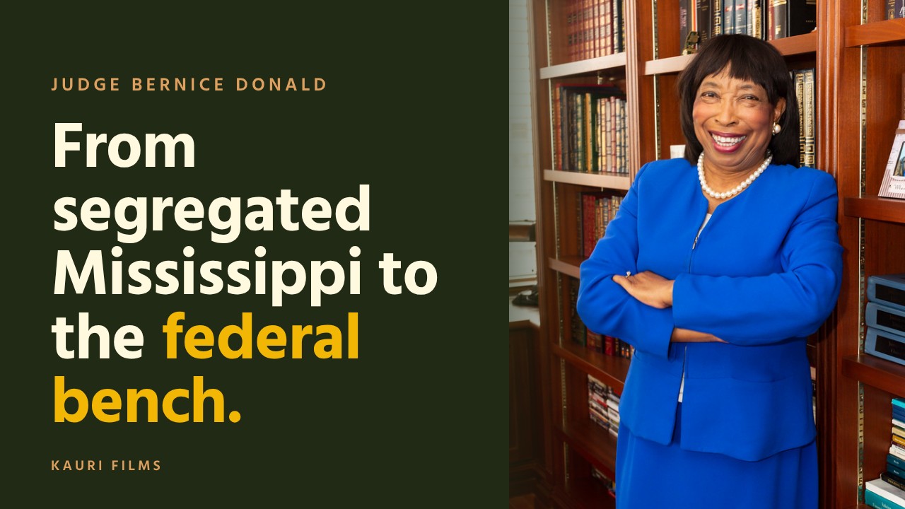Judge Bernice Bouie Donald smiling in front of a library of books.